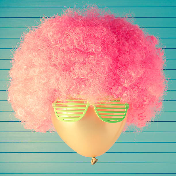 Party head made of balloon with pink curly hair