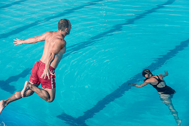istock Lifeguard jumping to the rescue 507581151