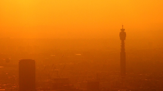 Smog covers London skyline at sunset