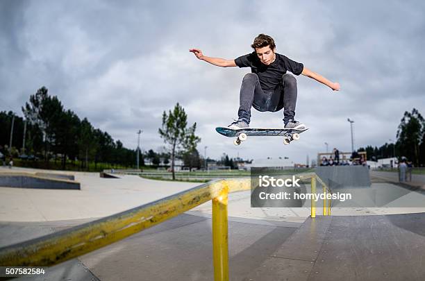 Skateboarder Doing A Ollie Stock Photo - Download Image Now - Skateboarding, Teenager, Stunt