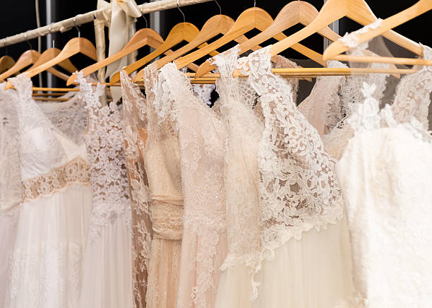 istock wedding dresses hanging on racks 507583032