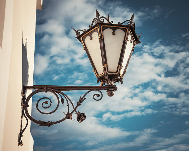 istock decorative  wall street lamp on blue sk 507583663