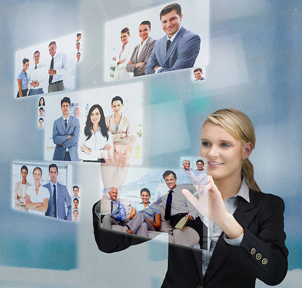 istock Blonde businesswoman selecting image from digital interface 507584633