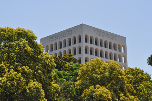 Rome, Italy - June 23, 2014: The Palazzo della Civilta Italiana aka Palazzo della Civilta del Lavoro or Colosseo Quadrato meaning Square Colosseum is an icon of Fascist architecture designed by Marcello Piacentini