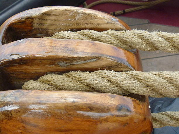 istock Rope passing through a wooden block (pulley)  on sailing boat 507619497