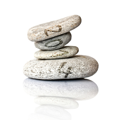 2014 written on a stack of pebbles, isolated on white background