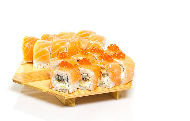 istock Sushi roll on a plate isolated on white background 507620261