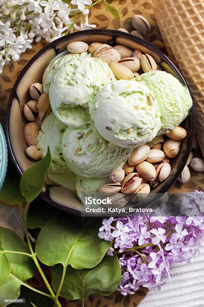 pistachio ice cream pistachio ice cream in a plate, pistachio and lilac Blueberry Stock Photo