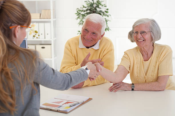 istock Elderly couple with consultant. 507620675