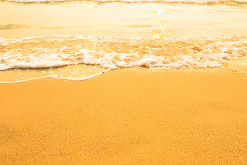 Soft wave of the sea, beach sand texture.