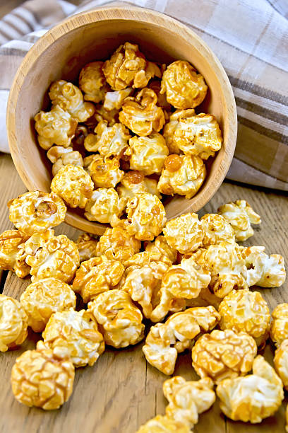 istock Popcorn caramel on board in bowl with napkin 507622425