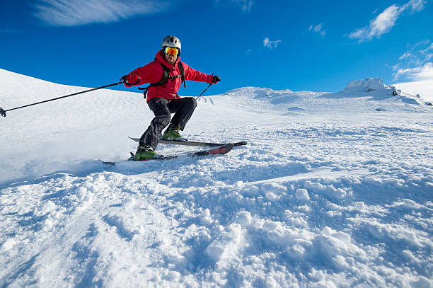 istock Skier turning on a blue sky day 507622519