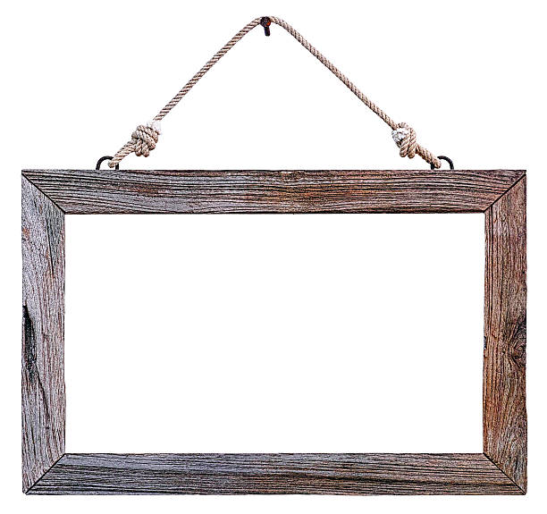 istock Old weathered natural wood frame hanging by rope. 507624023