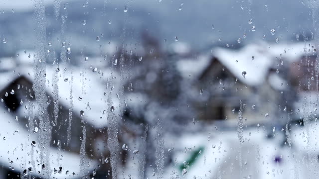 Raindrops on window. Time lapse.