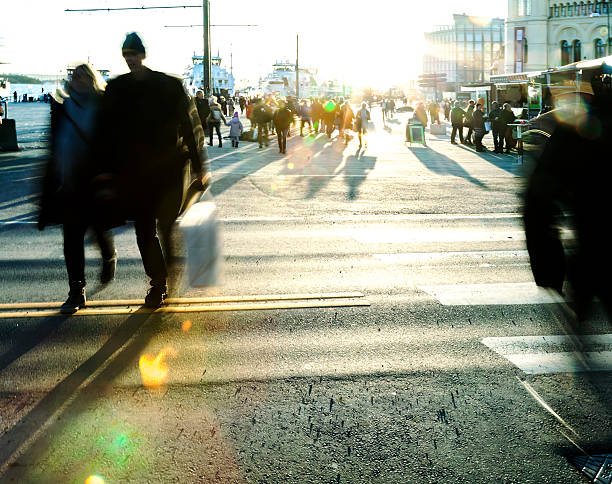 istock Backlit people  walking in the street at sunset. 507625918