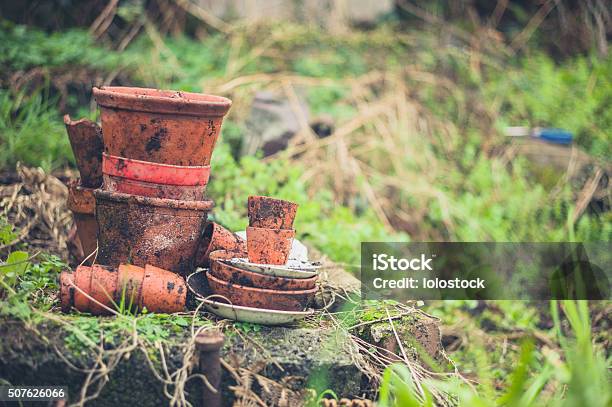 Stack Of Pot Planters In Garden Stock Photo - Download Image Now - Autumn, Ceramics, Cooking Pan