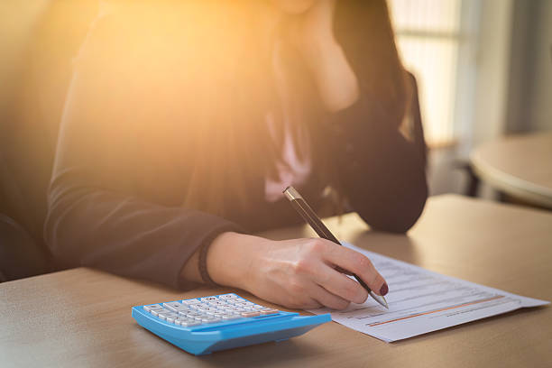 istock Business woman calculating an invoice 507629334