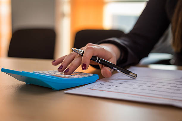istock Business woman calculating an invoice 507629366