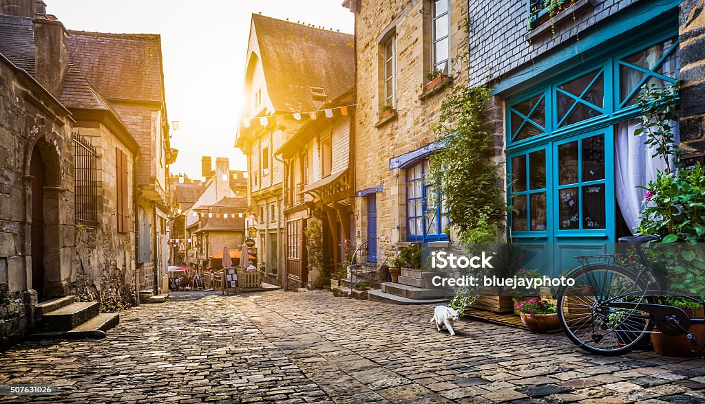 Old town in Europe at sunset with retro vintage filter Old town in Europe at sunset with retro vintage Instagram style filter and lens flare effect. France Stock Photo