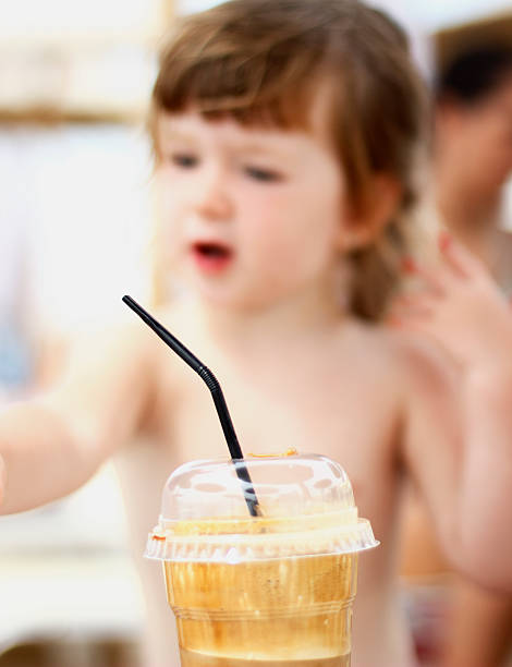 istock Happy child having a cup of coffee 507632344