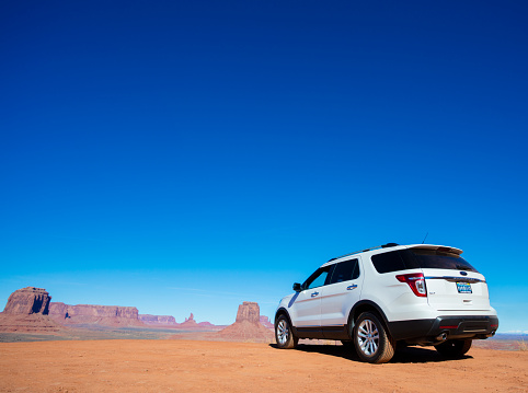 Monument Valley, USA - January 27, 2016: A 2014 Ford Explorer SUV exploring the views of Monument Valley, Arizona. 
