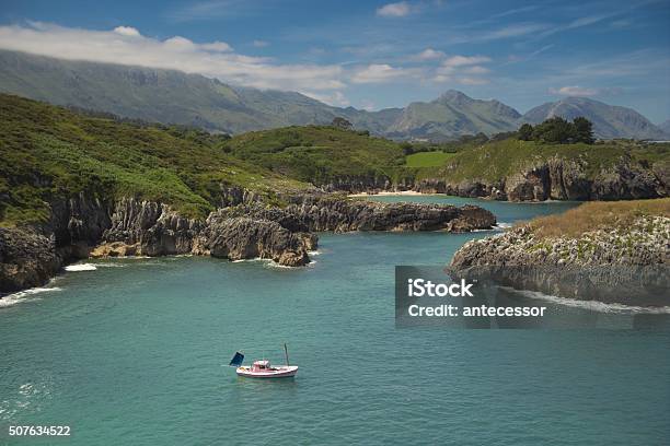 The Boat That Is Close To The Shore And Mountain Stock Photo - Download Image Now - Asturias, Bay of Water, Beach