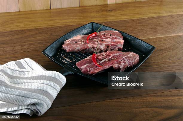 Raw Lamb Chops With Spices And Herbs On Wooden Background Stock Photo - Download Image Now