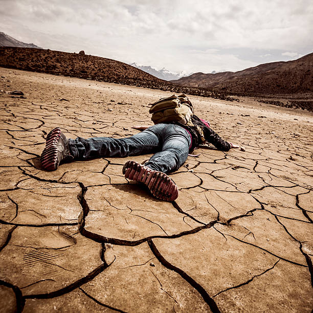 traveller lays on the dried ground
