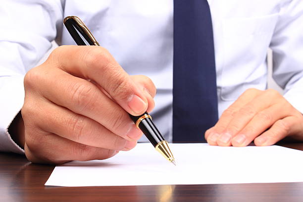 istock Business man writing on paper 507638952