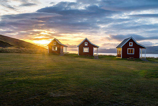 istock Cottage with greenery foreground and mountain range background during sunrise 507639152