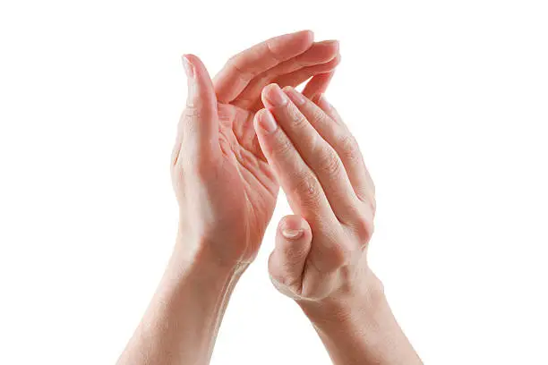 Photo of beautiful female hands isolated on white background applause