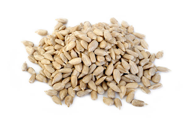 istock peeled sunflower seeds on white background 507641144