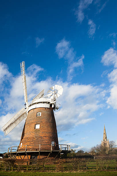 istock windmill and church in Thaxted typical English village 507641824