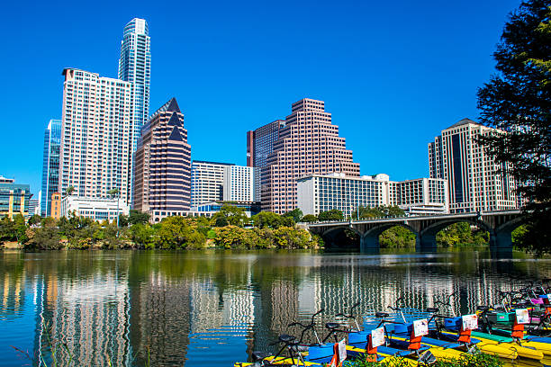 Water Activities Lady Bird Lake Austin Texas Downtown Water Activities Lady Bird Lake Austin Texas Downtown. A Perfect day in the Capitol City of ATX , the sun is out and the deep blue sky looks amazing behind the perfect Austin Skyline. on the edge of Town Lake water bikes are ready to play in the Colorado river  2016 stock pictures, royalty-free photos & images