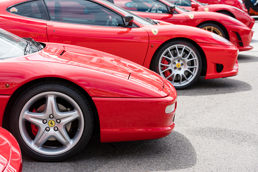 Melbourne, Australia - Oct 23, 2015: Row of red Ferrari on public display in a car show in Melbourne