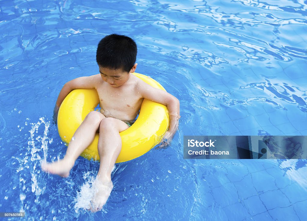 at pool A little boy having fun in a pool 4-5 Years Stock Photo