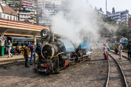 Darjeeling, India - March 11, 2014: The historic narrow-gauge steem-engine of darjeeling is running between darjeeling and Ghoom. The picture shows it at the station of Darjeeling.