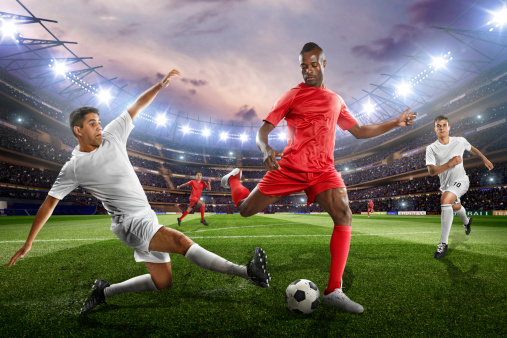 Dynamic airborne play. Dynamic soccer player kicks ball into air, showcasing unmatched skill against white background with green lush field. Concept of sport games, hobby, energy, movement. Ad