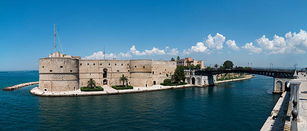 Aragonese castle and swing bridge Aragonese castle and swing bridge in Taranto, Italy ionian sea photos stock pictures, royalty-free photos & images