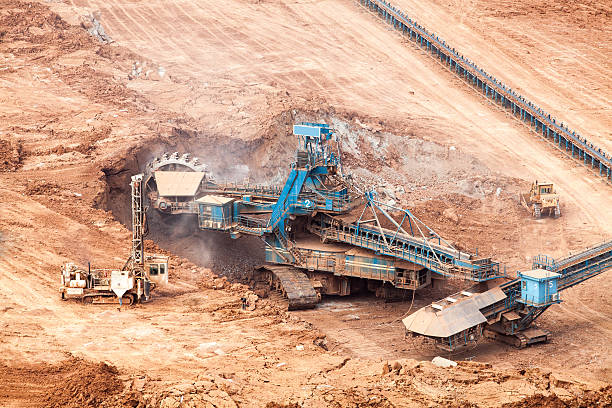 istock Part of a pit with big mining truck working 507655027
