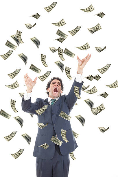 istock business man catching falling dollars banknotes and screaming 507655759