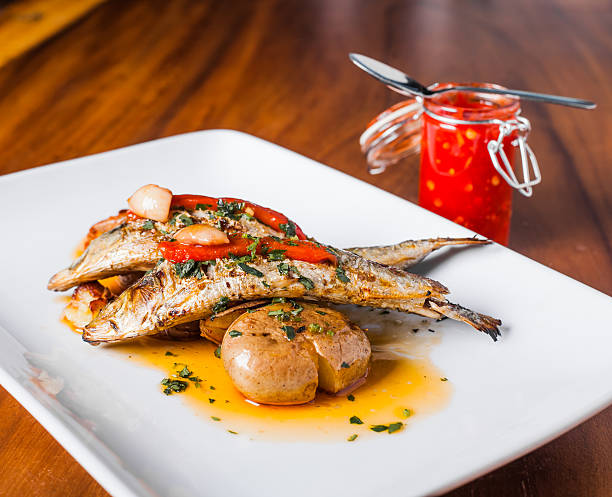 Grilled Sardines Plate with Red Pepper and Potato stock photo