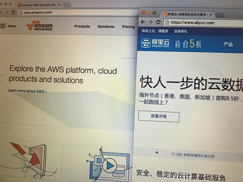 Beijing, China - January 28, 2016: Screenshot of the homepages of AWS(amazon) vs. Aliyun(alibaba).AWS and Aliyun are the leading cloud computing platforms by most enterprises or people around the world and China.