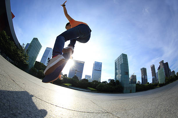 istock skateboarder skateboarding at sunrise city 507675724