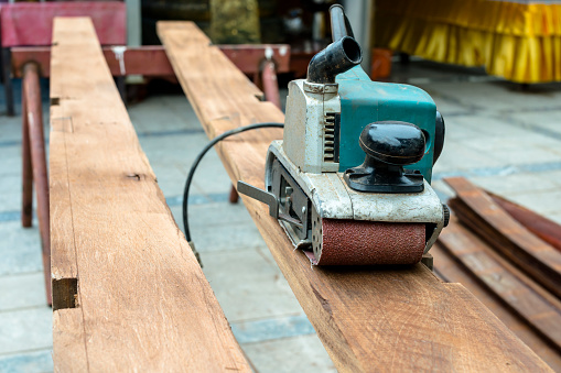Planing machine on wooden plank.