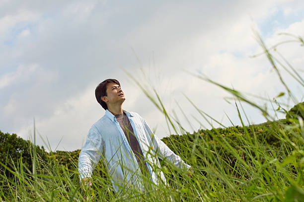 istock Chinese man smiling in nature 507676364