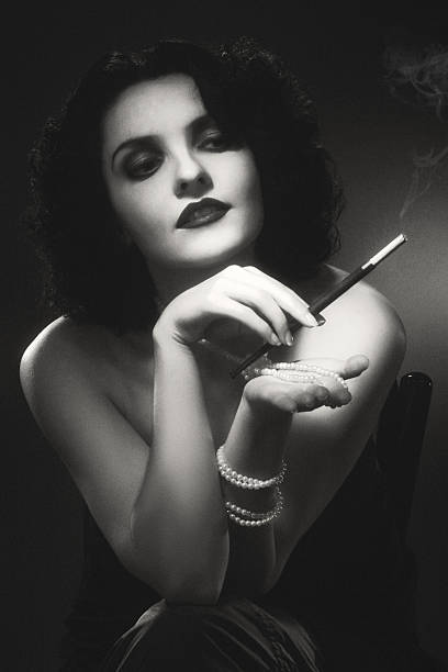 1940s style photo. Female portrait Black and white Retro-styled photo in 1940s style. Grain and some effects added for more deep and natural vintage effect. film noir style photos stock pictures, royalty-free photos & images