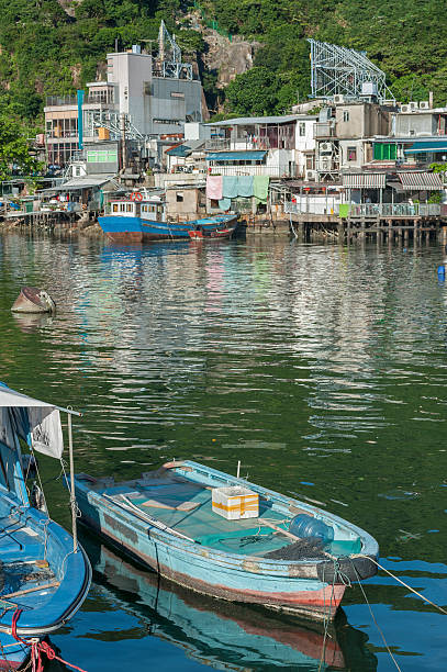 Fishing village in Hong Kong Fishing boat in typhoon shelter in Hong Kong view into land stock pictures, royalty-free photos & images