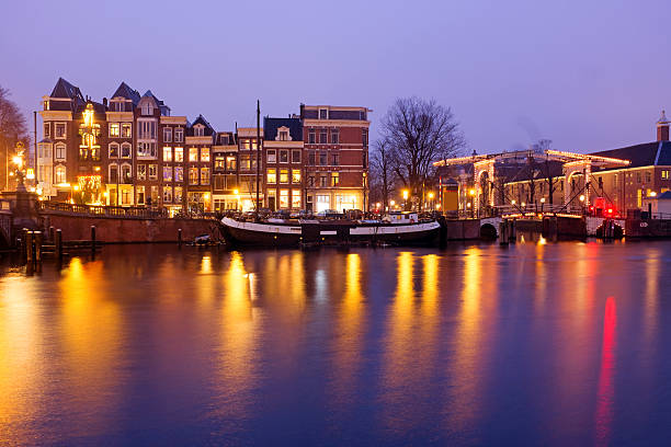 istock Amsterdam by night at the Amstel in the Netherlands 507681126