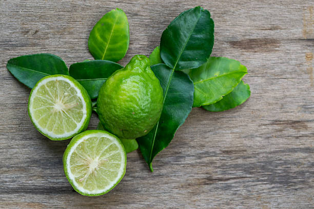 istock Bergamot with green leafs on wood background 507682628
